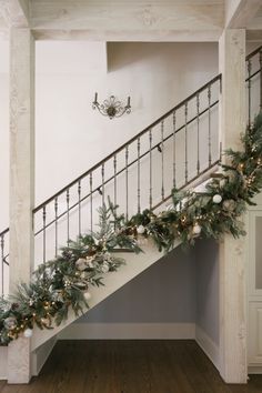 christmas garland on the bannister and stair railing