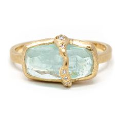 This sumptuously juicy aquamarine ring will have you thirsting for more. Diamonds flowing down the face of this imperfectly perfect pop of color. Celebrating our imperfections empowers us to see the true beauty that resides in us. Forged by our strengths and weaknesses, virtues and vulnerabilities, you are beautifully unique. A one of a kind just like this collection. Pictured in:14k yellow gold1.35ct Aquamarine.04ctw full cut white diamonds Luxury Gemstone Rings In Recycled Gold, Rings By June, Tourmaline And Diamond Ring, Aquamarine Ring Design, Baguette Aquamarine Ring, Unique Stone Setting, Aquamarine And Diamond Ring, Sapphire Baguette Ring, Gold Aquamarine Ring