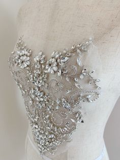 Rhinestone bead applique, crystal bodice patch, heavy bead handmade SIZE: 26cm at the widest point 25cm in height in central This stunning rhinestone applique is hand crafted, design with elegant florals. There is no iron on glue on the back, sew it to your dress . Suitable for bridal dress, evening dress and haute couture for special events, highly recommended for bridals and designers. SUPER LUXURY, HIGHLY RECOMMENDED! SIMILAR ITEMS: https://www.etsy.com/listing/1143786315/pale-blue-french-bea Wedding Corset With Sequins And Fitted Bodice, Embellished Corset With Sweetheart Neckline, Glamorous Embellished Wedding Dress With Sweetheart Neckline, Embellished Wedding Dress With Fitted Bodice, Embellished Wedding Dress With Fitted Bodice And Sweetheart Neckline, Fitted Wedding Dress With Rhinestones, Glamorous Embellished Wedding Corset, Fitted Sequin Wedding Corset, Glamorous Sequined Corset For Wedding