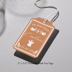 a luggage tag with the name mi bautiko on it hanging from a string