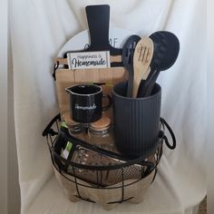 the kitchen utensils are organized in a basket