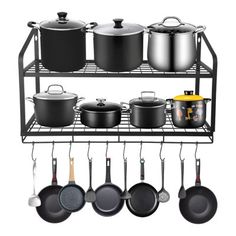 pots and pans are hanging on a rack