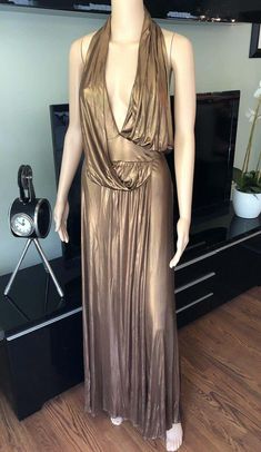 For Sale on 1stdibs - Gucci Runway F/W 2006 Plunging Neckline Backless Halter Gold Metallic Dress Gown XS Gucci Fitted Maxi Dress For Formal Occasions, Gucci Formal Maxi Length Dress, Gucci Fitted Maxi Dress, Elegant Gucci Evening Maxi Dress, Gucci Elegant Evening Maxi Dress, Gucci Evening Maxi Dress, Gucci Maxi Party Dress, Gucci Maxi Dress For Party, Gucci Maxi Length Party Dresses