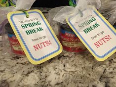 two jars of nut butter with tags on them that say spring break, time to go and nuts