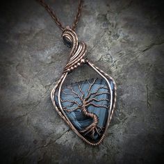 Botswana Agate Tree of Life - elegantly wrapped in oxidized and hand-polished copper. This handcrafted pendant comes with an antique copper chain in the length of your choice. *Shown in the last photo on an 18 inch chain. Agate cleanses and stabilizes the aura, eliminating and transforming negativity. It enhances mental function, improving concentration, perception and analytical abilities. It soothes and calms, healing inner anger or tension and creates a sense of security and safety. Your purc Agate Wire Wrapped Jewelry For Meditation, Spiritual Hand Wrapped Moss Agate Jewelry, Nature-inspired Wire Wrapped Agate Jewelry, Nature-inspired Moss Agate Wire Wrapped Jewelry, Wire Wrapped Stone Jewelry, Oxidized Copper, Botswana Agate, Wire Wrapping Stones, Wire Necklace