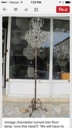 a large crystal chandelier in front of a store window