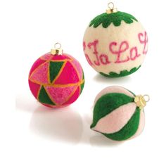 three ornaments that say to eat and one is decorated with pink, green and yellow