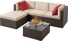 an outdoor furniture set with coffee table and couch