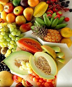 a variety of fruits are arranged on a plate