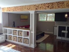 a living room filled with furniture and lots of storage