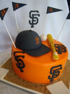 a cake that has some baseball bats on it