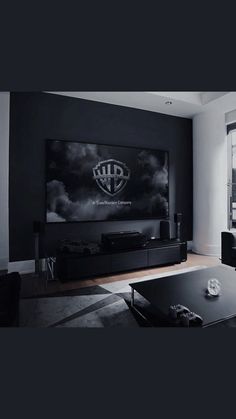 a living room filled with furniture and a large flat screen tv mounted to the wall