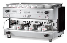 an espresso machine with four cups on the front and two mugs on the back