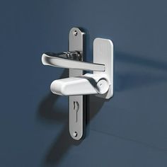 a door handle on a blue wall with a white latch and two keys in it