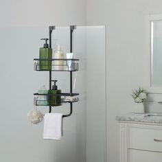 a bathroom with a sink, mirror and towel rack