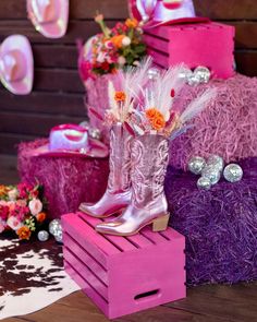 pink and purple western themed decorations with cowgirl boots