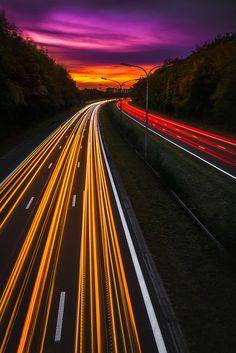 long exposure photograph of traffic on highway at dusk