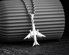 Vintage Airplane Necklace, which crafted as 925 Sterling Silver, is a perfect gift for him. Travel Necklace isn't just about accessorizing; it's a personal canvas for showcasing your style and individuality. To order Flight Aviator Necklace, please choose your chain type and size from the dropdown lists. Mens Airplane Necklace remains a timeless favorite, cherished as one of their most beloved gifts for men. Crafted with premium handiwork, our handmade necklaces boast exceptional quality and att Plane Necklace, Airplane Necklace, Travel Necklace, Vintage Airplane, Necklace Mens, Vintage Airplanes, Perfect Gift For Him, Silver Jewelry Handmade, Travel Lover