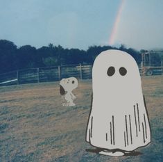 there is a ghost and a dog in the yard with a rainbow in the background