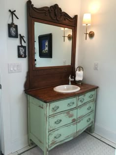 a bathroom with a sink and mirror in it