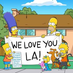 the simpsons family is holding up a sign that says we love you la in front of their house