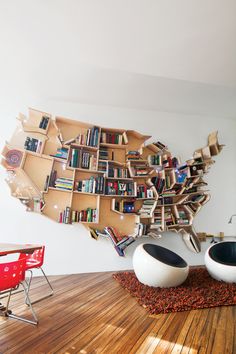 a large book shelf with many books on it in the shape of the united states