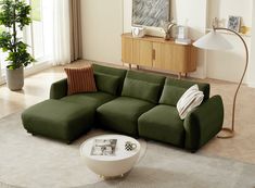 a living room with a large green couch