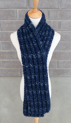 "This beautiful hand knitted scarf is made with Super Bulky and Soft Wool Blend Yarn (80% Acrylic, 20% Lambswool). Classic ribbed pattern, it looks the same on both sides. The scarf can be worn in multiple ways. Very beautiful colors: shades of navy, blue, and light blue. The colors may appear slightly different on different monitors. Measures: 63\"- 65\" (160-165 cm) long x 7\" (18 cm) wide. From a smoke-free home. Care instructions: Hand wash in cool water and dry flat." Cozy Blue Chunky Knit Pattern, Blue Knitted Scarves For Winter, Blue Knitted Winter Scarves, Blue Yarn Knitting Pattern For Winter, Winter Blue Yarn Knitting Pattern, Winter Knitting Pattern In Blue Yarn, Cozy Blue Knit Knitting Pattern, Knit Acrylic Yarn Scarves, Blue Knitted Yarn Scarves