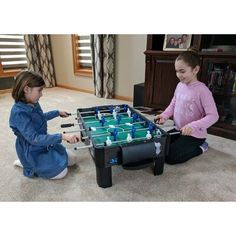 This is the perfect size foosball table for young players! The 37'' Foosball Table is easy to assemble and store. This table provides a great way to build hand-eye coordination, reflex speed, and promote healthy competitiveness. The AirZone Play 37'' Foosball Table comes with three foosball (soccer) balls, nine ABS molded players on each team placed on six fully rotating bars and on-goal score-keeping. This sturdy MDF constructed table will stand up to even the most exciting young gamerâ€™s best Foosball Table, Foosball, Soccer Balls, Dyson Vacuum, Stand Up, Black And Brown, Home Appliances, Soccer, Blue And White