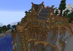 an image of a castle built on top of a mountain in minecraft with lots of trees and rocks