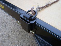 the chain is attached to the flatbed trailer