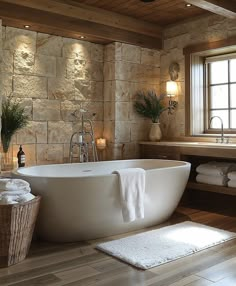 a large white bath tub sitting next to a window