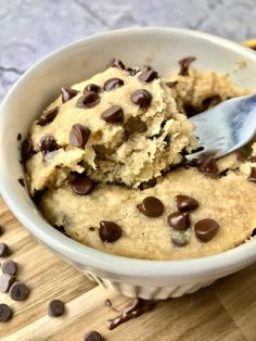 a white bowl filled with chocolate chip cookie dough