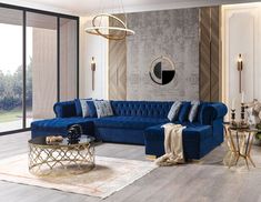 a modern living room with blue couches and gold coffee table in the center area