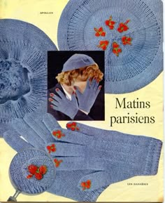 an old knitting pattern for mittens and gloves with red flowers on the front, in blue