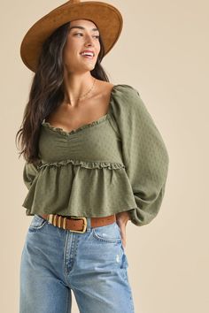 This textured babydoll top features ruffled hemming for a playful and feminine touch. Perfect for pairing with jeans or a skirt, this versatile piece adds a touch of whimsy to any outfit. Flowy Peasant Top With Ruffles, Fitted Puff Sleeve Peasant Top With Ruffles, Green Babydoll Top, Free People Babydoll Top, White Dress Skirt, Football Dress, Chic Off-shoulder Ruffled Peasant Top, Ruffles Fashion, Skirts With Boots