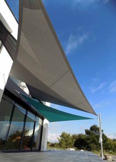 a large white building with an awning on it's side