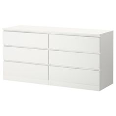 a white dresser with four drawers and two doors