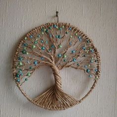 a wicker tree with blue and green beads