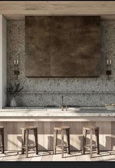 an image of a kitchen setting with bar stools and countertop area in the background