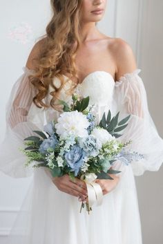 a woman in a wedding dress holding a bouquet