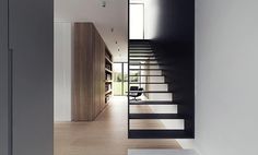 an open door leading to a room with stairs