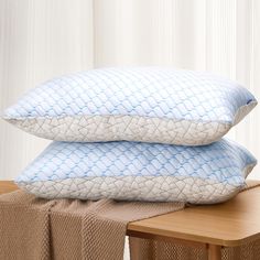 two pillows stacked on top of each other