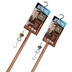 two wooden sticks with hooks attached to them