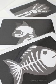 four skeleton stickers on top of each other in different shapes and sizes, with the same design