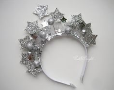 Silver star crown for girls or women.  This headband with handmade silver stars adds beautiful sparkle to any daily outfit, special occasions and Christmas celebrations. It is attached to hard silver headband. This headband fits 2 and up. They are also great for BIRTHDAY GIFT. All items are handmade with attention to detail in a smoke free environment. Many other stiles and colors of cute hair clips, headbands, shiny crowns on my shop  https://www.etsy.com/shop/PinkandBright . Take a peek! Thank Celestial Crown, Star Crown, Headband Fits, Crown Headpiece, Silver Head Piece, Star Headband, Silver Headband, Headband For Women, Galaxies Stars