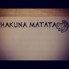 the word hakuna matata written in black ink on a white piece of paper