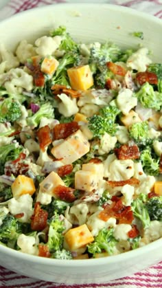 loaded broccoli cauliflower salad in a white bowl with text overlay that reads loaded broccoli cauliflower salad low carb