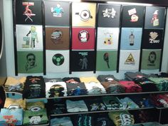 there are many t - shirts on display in the store