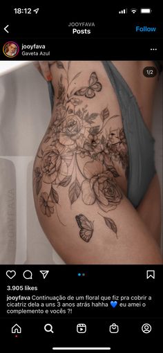 a woman's stomach with flowers and butterflies on it, in the bottom half of her body